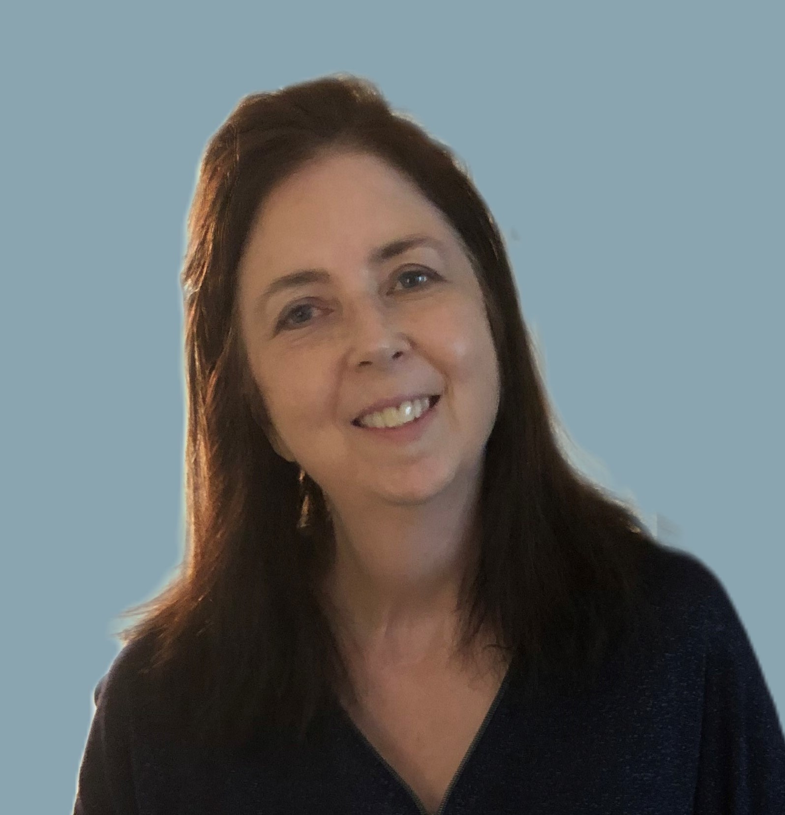 sheila-headshot-with-blue-background